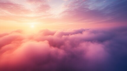 Vibrant sunset above a sea of clouds.