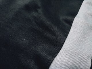 The texture and background of the fabric is black with white lines