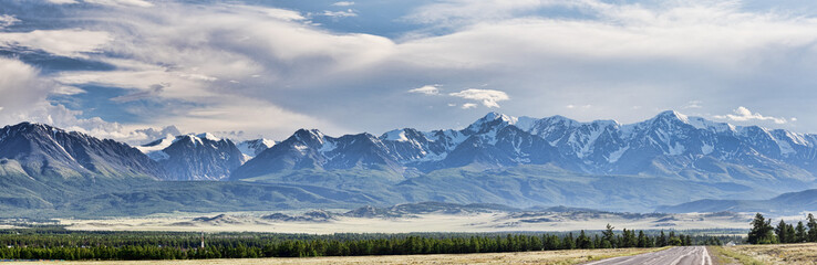 Fototapeta premium high snow mountain panorama under grey cloudy sky