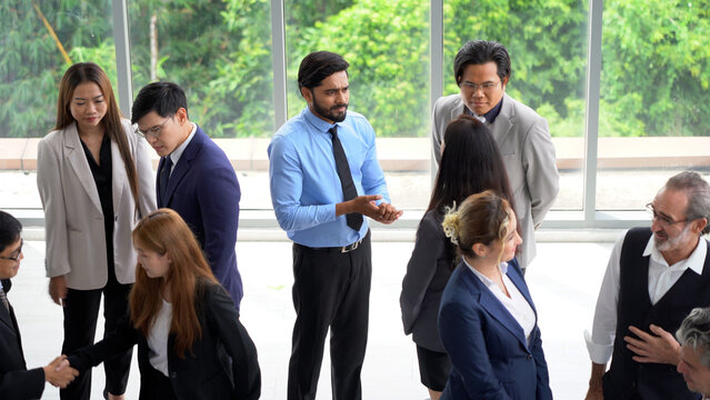 group of diverse business team building standing and talking and introduce yourself after meeting in seminar conference . Multicultural business people discussing or having a conversation