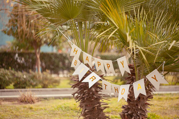 a romance sign between palm trees for a birthday, anniversary, created with affectionate