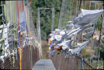 buddhist flags on the suspension bridge