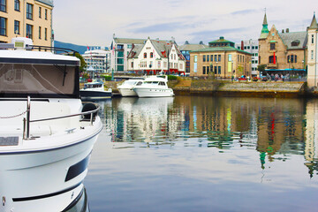 Alesund city on a summer day, Norway. View of colorful Art Nouveau architecture port