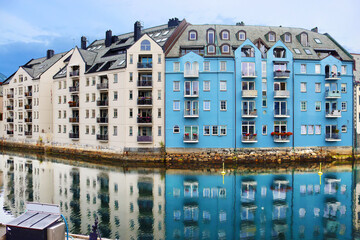 Alesund city on a summer day, Norway. View of colorful Art Nouveau architecture port