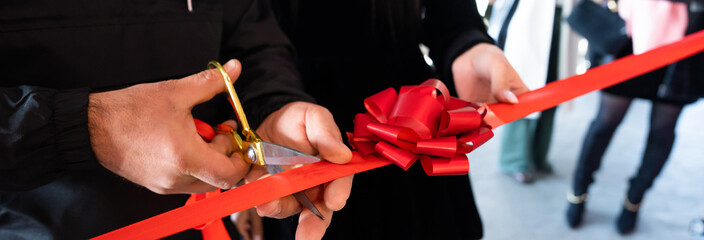 The opening of a house or a store, the moment of cutting the red ribbon