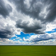 Fototapeta premium green field and cloudy sky
