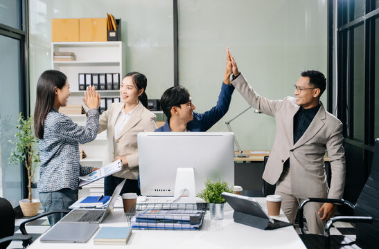 Young people professional colleagues are stretching arms showing team spirit focus on hands.