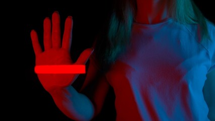 Woman touches glass screen panel, open palm print on transparent surface, red light scanner scanning the hand print. Template for digitalization concept.