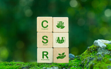 Corporate Social Responsibility (CSR) with green CSR icon on wooden block. Corporate Social Responsibility, Sustainability or Sustainable Development concept.
