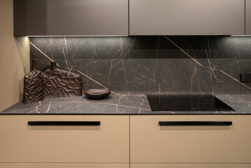 Modern induction hob with designer details in the kitchen
