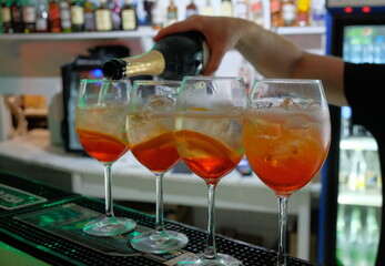 pouring red wine into a glass