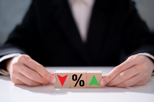 Income debt interest percent inflation with increase and decrease icon on wooden block finance business economy investment concept