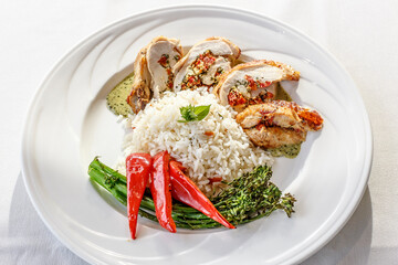 A plate of food with rice, broccoli, and chicken