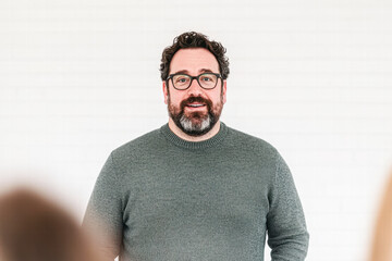 Fototapeta premium Motivational public speaker delivers insightful talk in modern office video environment