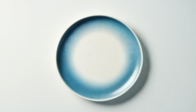 Empty plate with blue pattern edge, Ceramic plate with spiral pattern in watercolor styles, View from above isolated on white background with clipping path