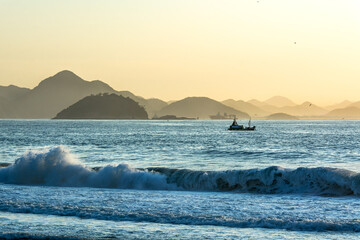 Fishing boat on the Atlantic Ocean in front of Copacabana beach in Rio de Janeiro