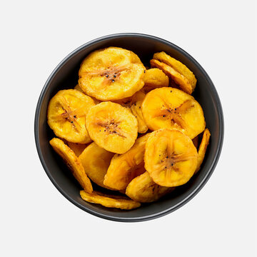 Fried plantain chips or chifles, photographed close up, isolated on white background