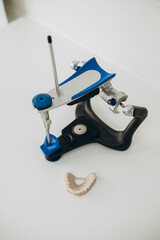 Dental appliance adjustment tool with a mouthguard on a clean countertop