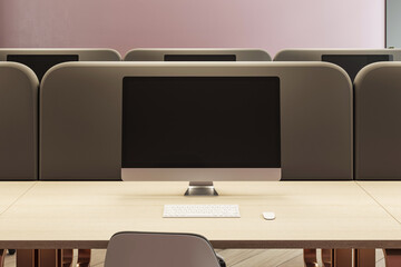 Modern office workspace with computer monitor, keyboard, and mouse on wooden desk, surrounded by dividers, contemporary design. 3D Rendering