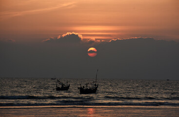 Fishing boats at the sunset