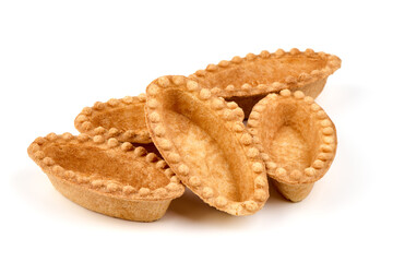 Empty tartlet shells, isolated on white background.