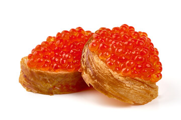 Red caviar on a crispy bread slice, isolated on white background.