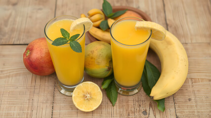 a glass of orange juice with a garnish of fruit around it on a wooden table with leaves, Ay-O, rayonism, professional food photography, a stock photo