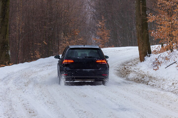 Car on the snowy mountain road during severe conditions