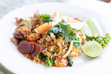 Fried rice with meat, egg and vegetables, simply and delicious menu in Thai style.