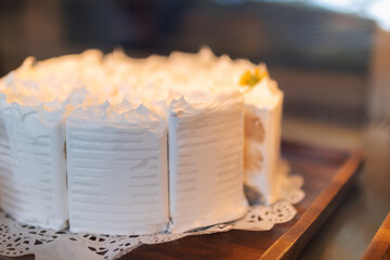 Coconut cake with young coconut on top.