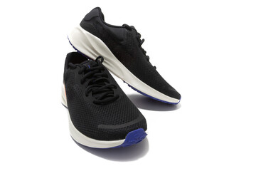 Black and white running shoes. Recycled materials. Isolated on a white background.