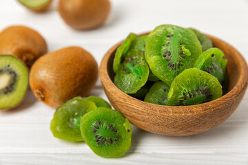 Kiwi dried fruit on wooden background. kiwi candied fruit. Healthy food. Ingredient for baking cupcakes. Healthy snack, vegetarian sweets. Space for text. Copy space