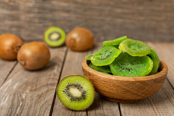 Kiwi dried fruit on wooden background. kiwi candied fruit. Healthy food. Ingredient for baking...