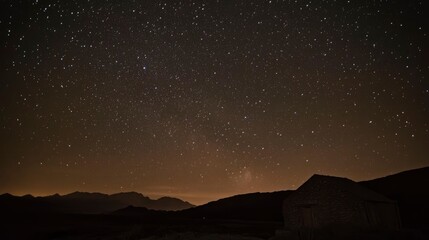 Fototapeta premium Starry Night Sky Over Mountain Hut