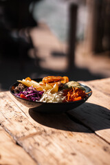 Healthy fruit and salad, sliced vegetables in a bowl