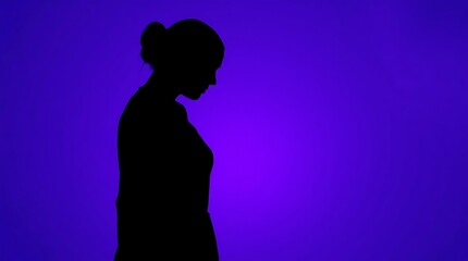 Silhouette of a Person Against a Vibrant Purple Background with Radiant Light
