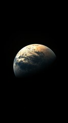 Half of planet earth illuminated by the sun, rotating in the dark space