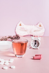 Insomnia remedies and sleep accessories on the table  vertical view
