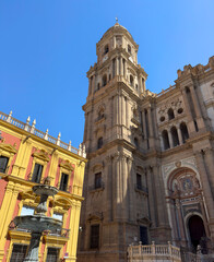 Fototapeta premium view to the catholic cathedral Santa Iglesia Catedral Basílica de la Encarnación, the Fuente Plaza del Obispo fountain and Centro Cultural Fundación Unicaja de Málaga museum, Costa del Sol, Andalusia