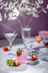 Elegant strawberry cocktails and crystal stemware with decorative white leaves