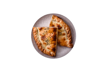 Cheburek meat pastry pie with herbs on the white background