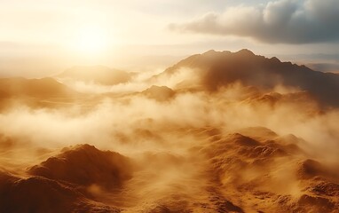 Sunset over misty, orange mountains.