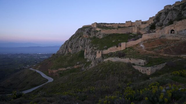 Acrocorinth historic castle on top of the mountain at sunset in Greece