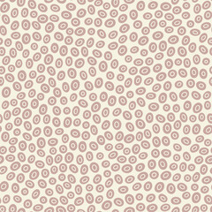 Seamless pattern with irregular, organic oval shapes in the muted, earthy tones