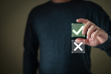 A person selects a glowing green checkmark from a holographic interface with a choice between a...