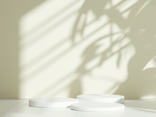 White cylindrical podium with tree leaf shadow background, illuminated by soft sunlight
