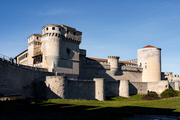 Majestic Cuéllar Castle: A Medieval Fortress Standing Proud Against a Blue Sky.
