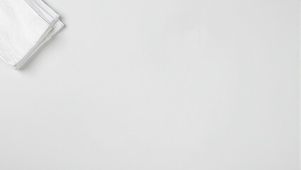 Top view of pale gray ceramic countertop with stack of folded white kitchen towels perfect for meal prep