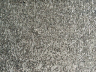 shiny reflective material with aluminum crumpled coating, silver ribbed texture of...