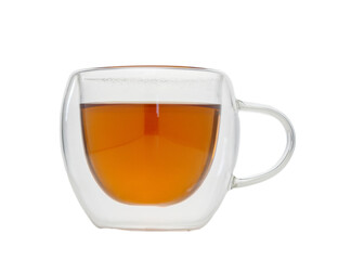 Enjoying a warm cup of herbal tea in a cozy glass mug on a relaxing afternoon at home